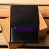 Minimalist leather wallet in black displayed fully open – refined bifold for everyday carry